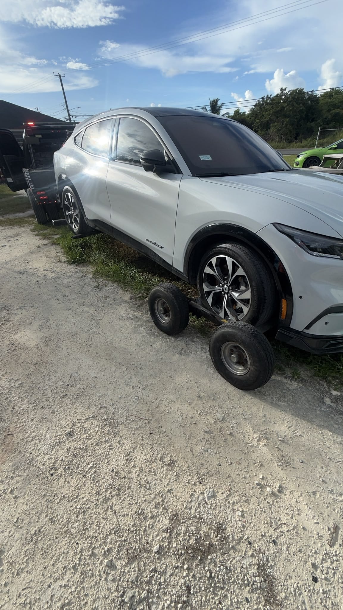 Electric SUV being moved on dollies to protect the drivetrain